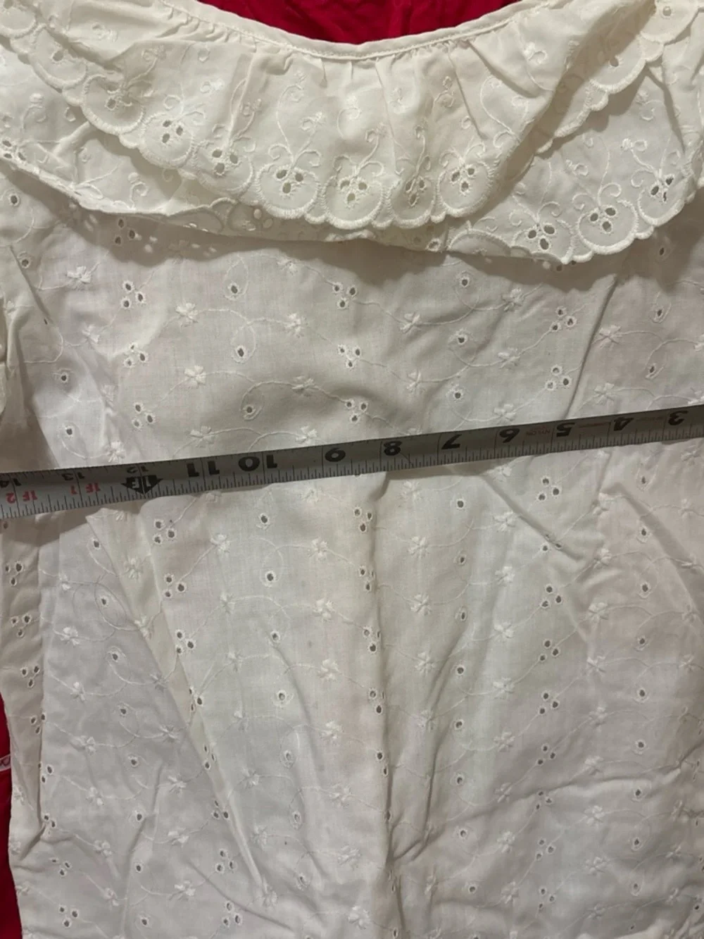 Folclórico Red skirt with white polka dots and green trim, with a white top and